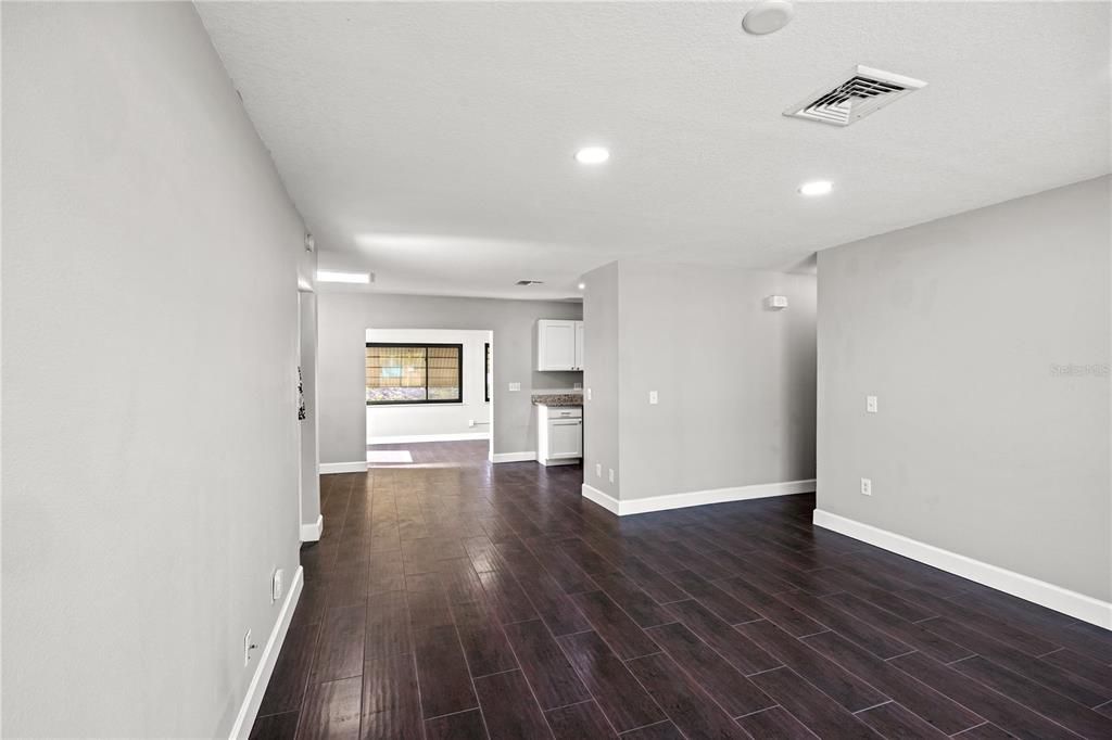 Living room looking into dining room and large florida room under air