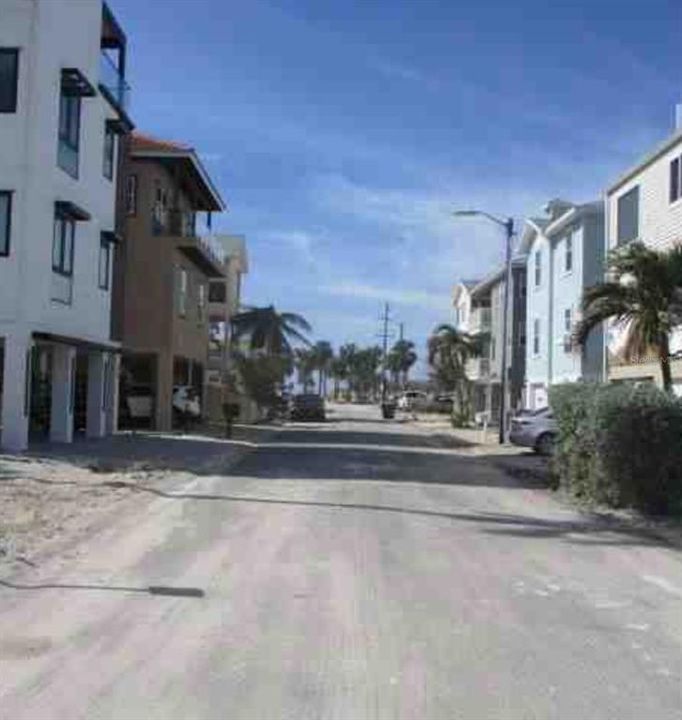 Street view looking towards the beach. Most homes are rebuilt to code on this street.