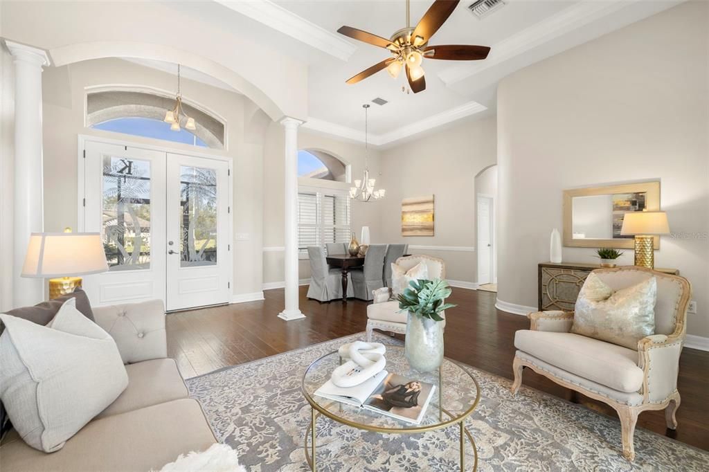 Formal family room and dining room with front doors