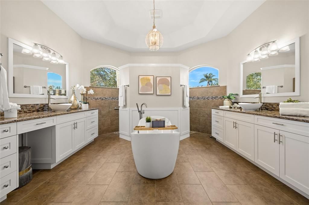 Primary bath ensuite with soaking tub, split Granite sink vanites