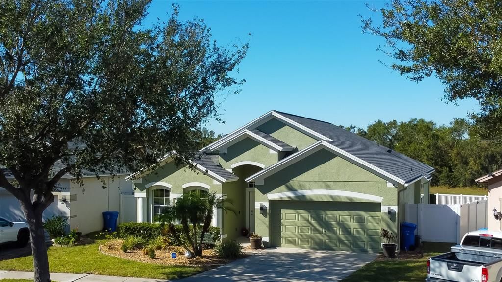 Freshly painted exterior - home is sitting on a conservation pond lot