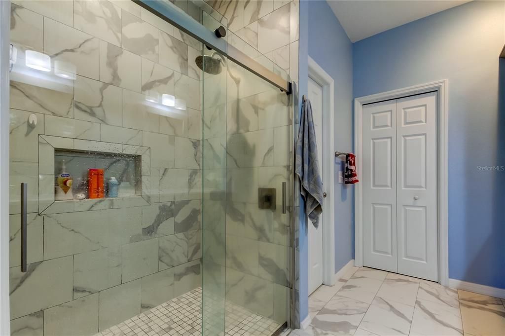 En-suite primary bathroom features large walk in closet