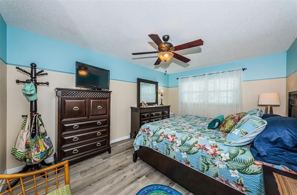 Master bedroom with king-sized bed with drawers for extra storage