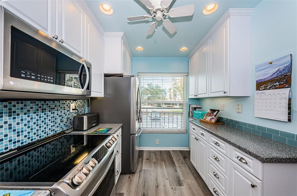 Pretty kitchen with beautiful backsplash with the colors of the sea