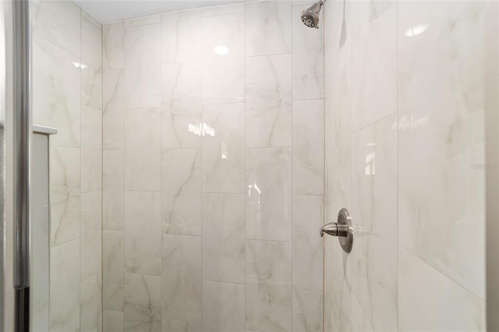 Beautiful ceramic tiled walk-in shower