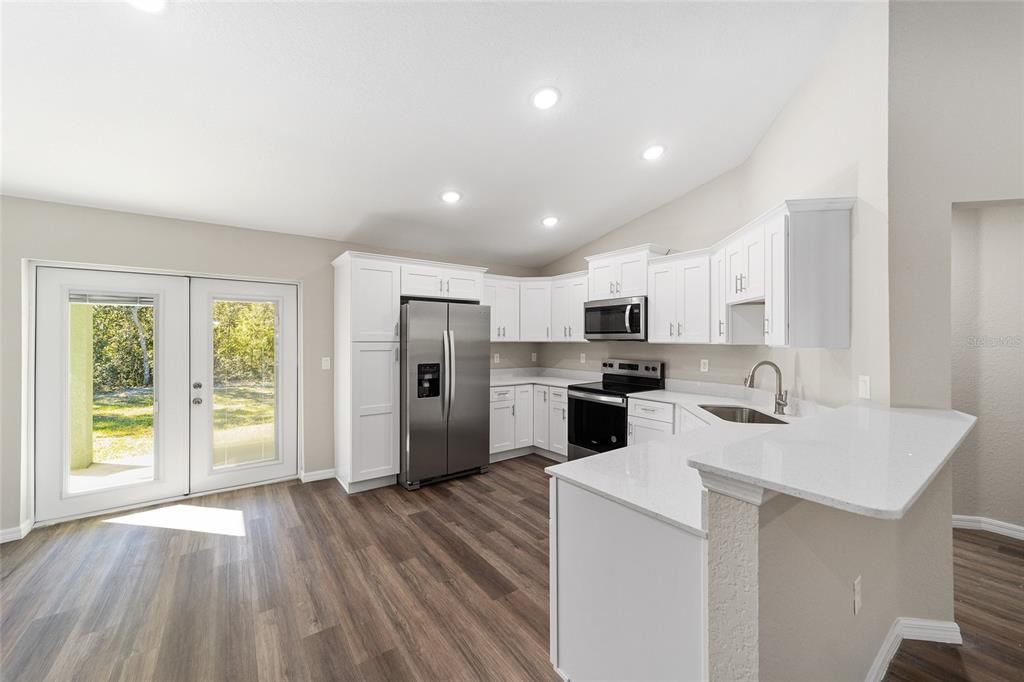 Quartz countertops, wood soft close cabinets & Pantry