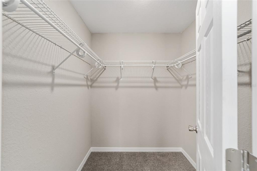 Nice sized walk-in closet with shelving