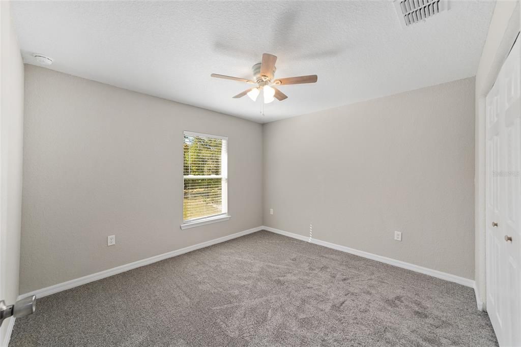 Bedroom 2 soft carper, ceiling fan, blinds