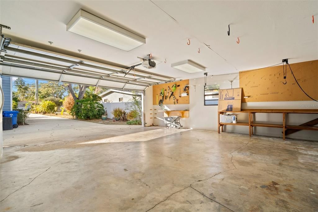 2 car garage showing the privacy wall  and door entering the single car garage with climate controls.