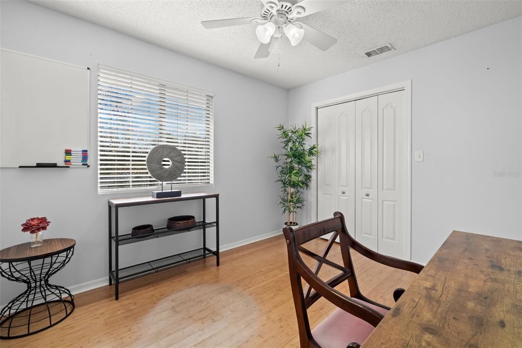 Hardwood floors, natural light overlooking the backyard.