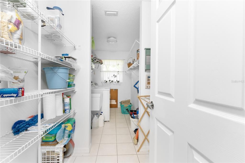 The laundry room features a utility tub and GE washer & dryer.