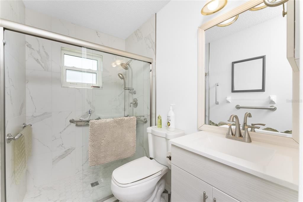 This HUGE laundry room has tiled flooring and plenty of storage.