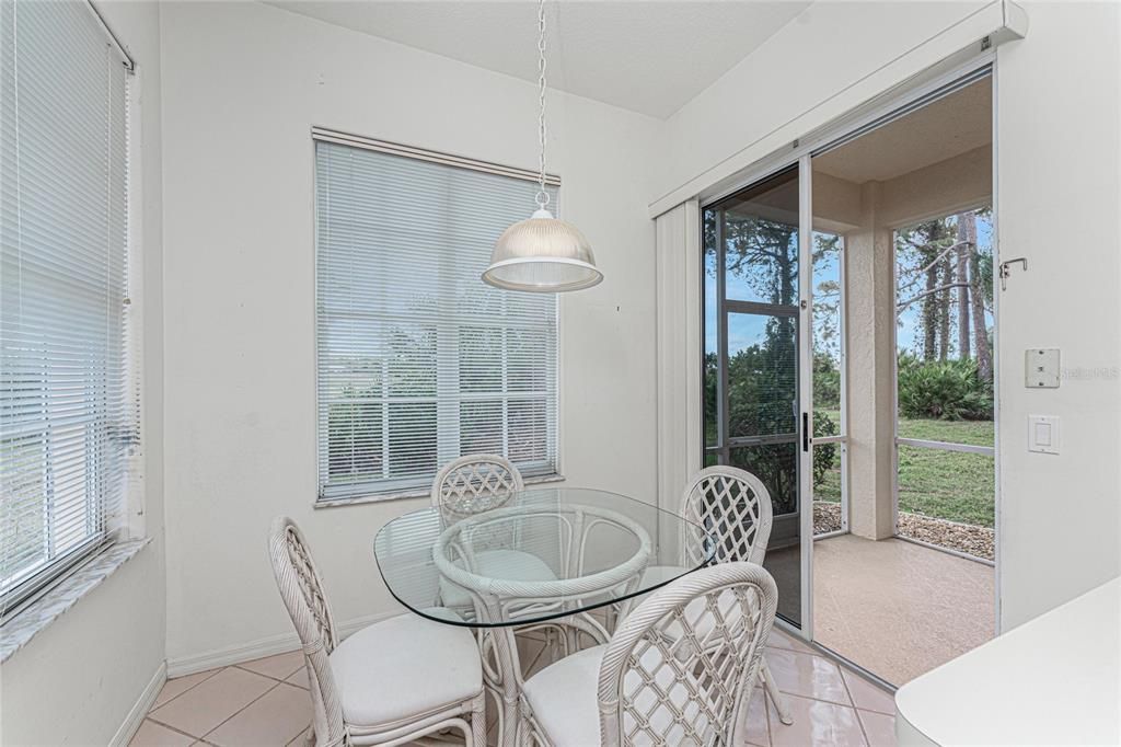 Breakfast nook and patio doors to the lanai and back yard (then the golf course).