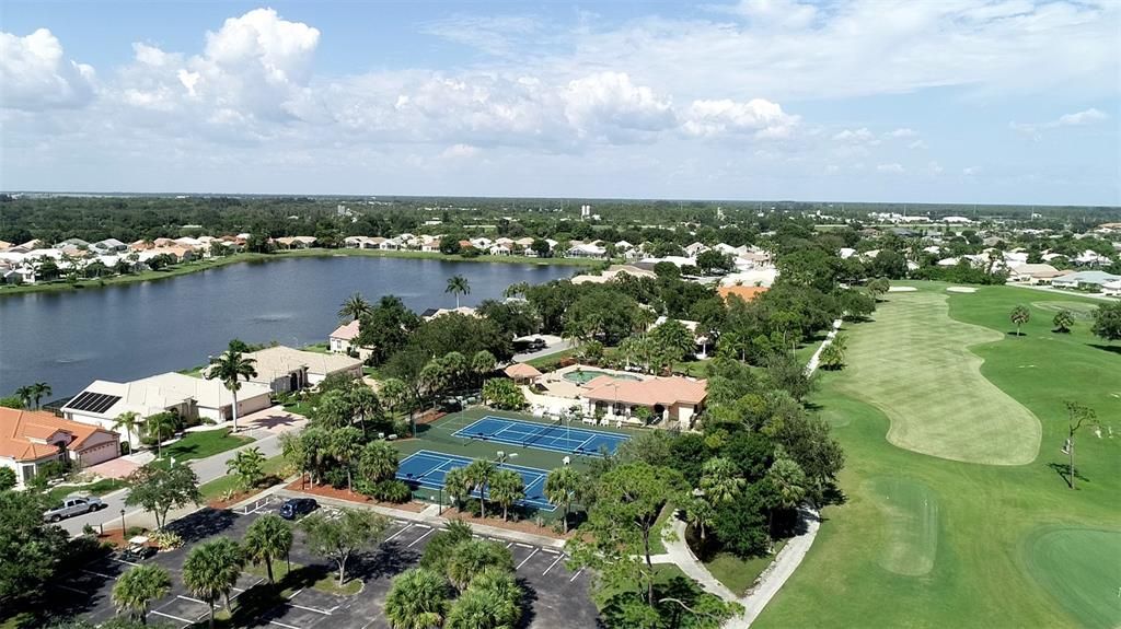 Aerial of the Seminole Lakes Country Club tennis courts, fitness center and pool.