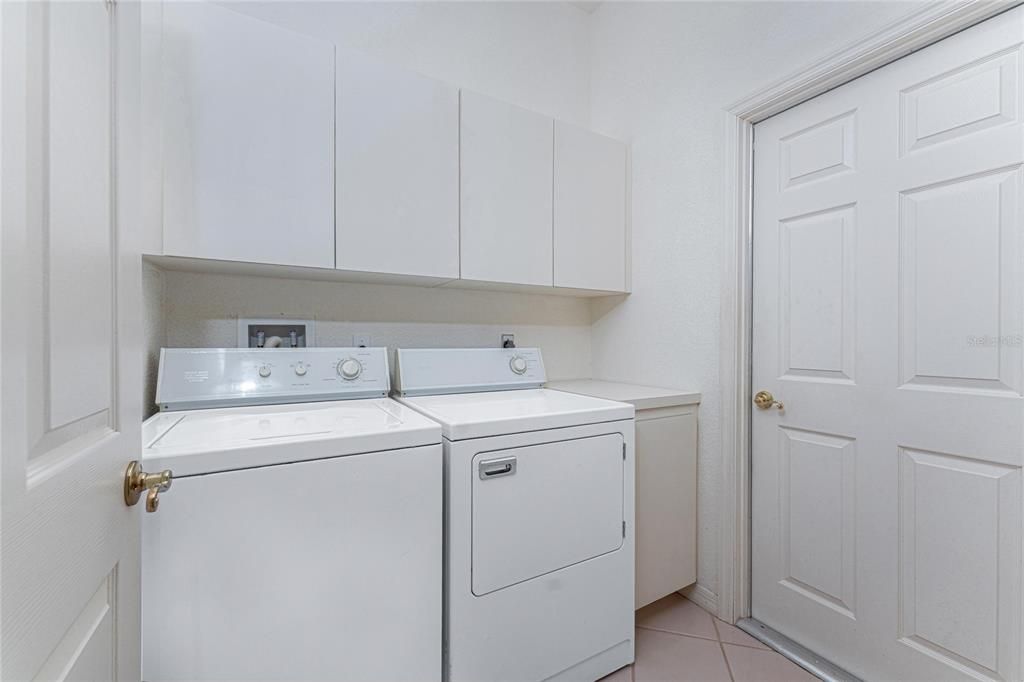 The laundry room and the closed door leads to the double garage.