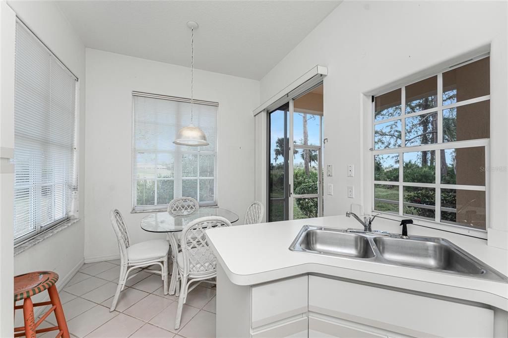 The kitchen sink view of the golf course and dinette area.