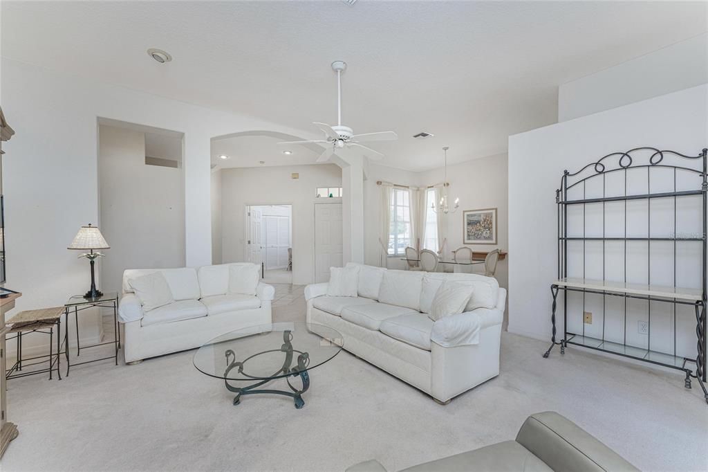 Living room, dining room, foyer and den.