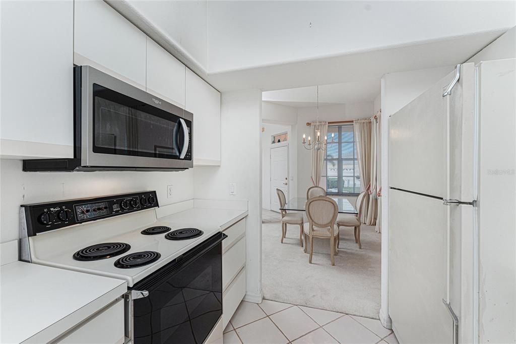 Kitchen and dining room (with the foyer in the background).