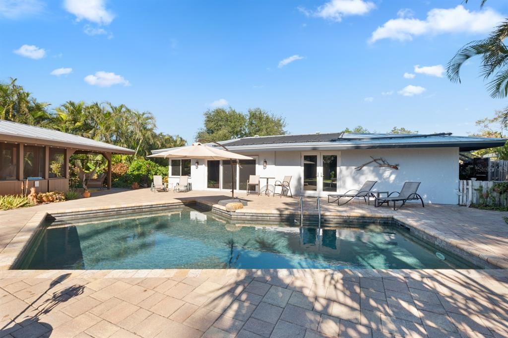 Salt water pool and back view of house