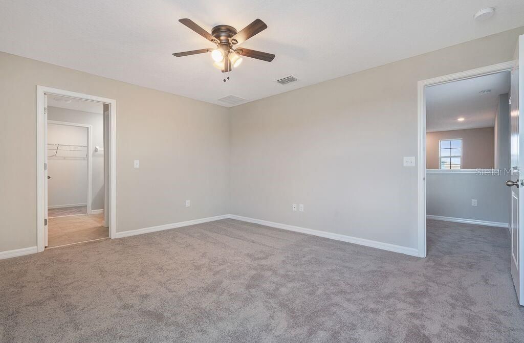 MASTER BEDROOM LOOKING INTO ENSUITE BATH & WALK-IN CLOSET