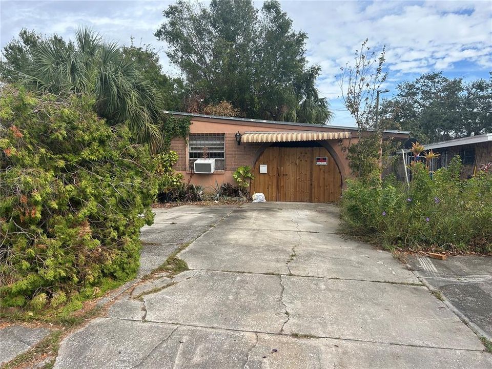 Front driveway to gated carport