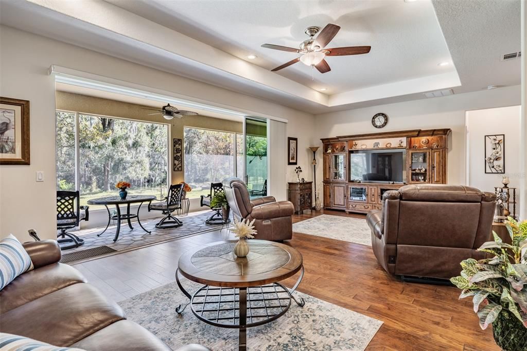 Great room with tray ceiling and pond/conservation views!