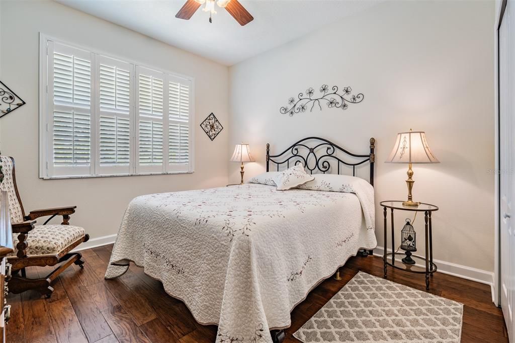 Guest bedroom with plantation shutters