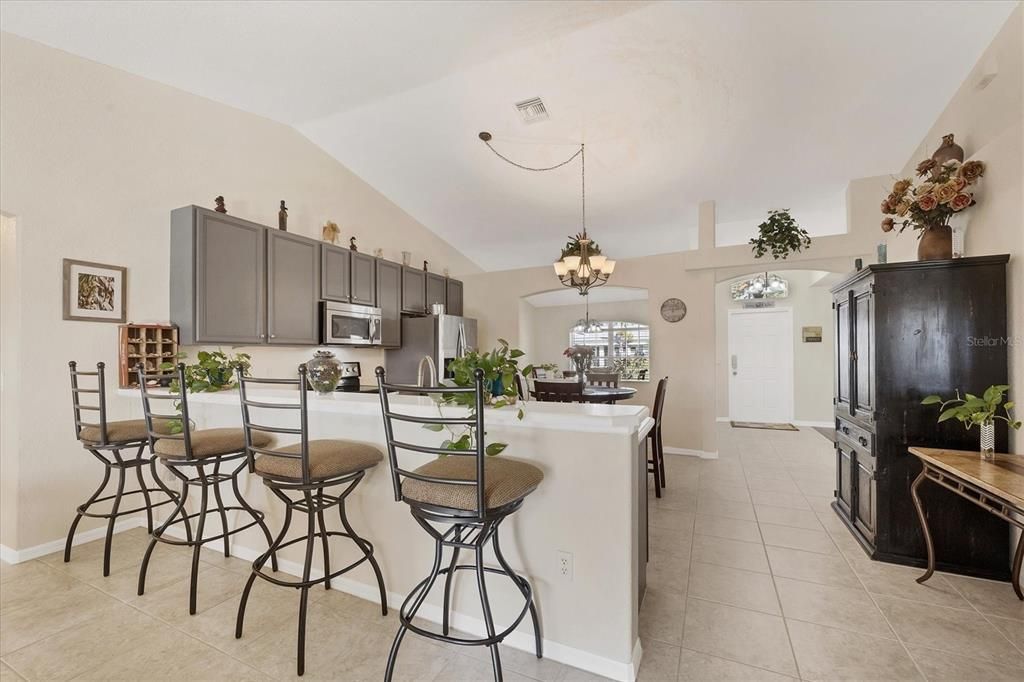 A raised breakfast bar in the kitchen provides comfortable seating for four.