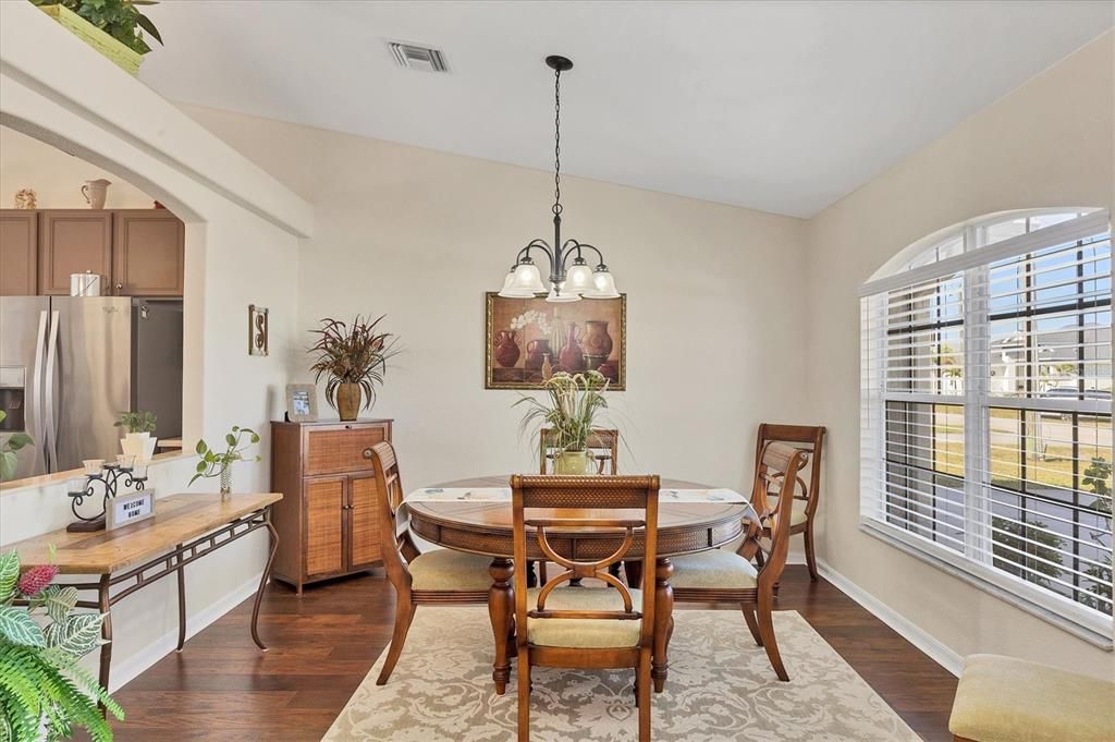 with a dining room that is visually open to the kitchen.