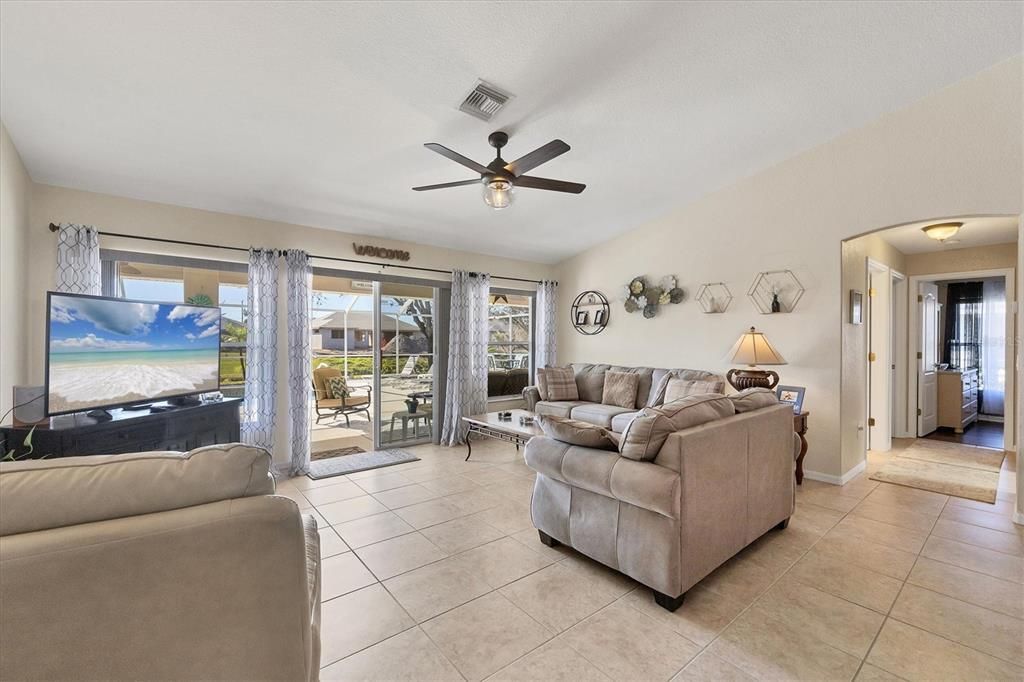 Soaring cathedral ceilings highlight the family room...