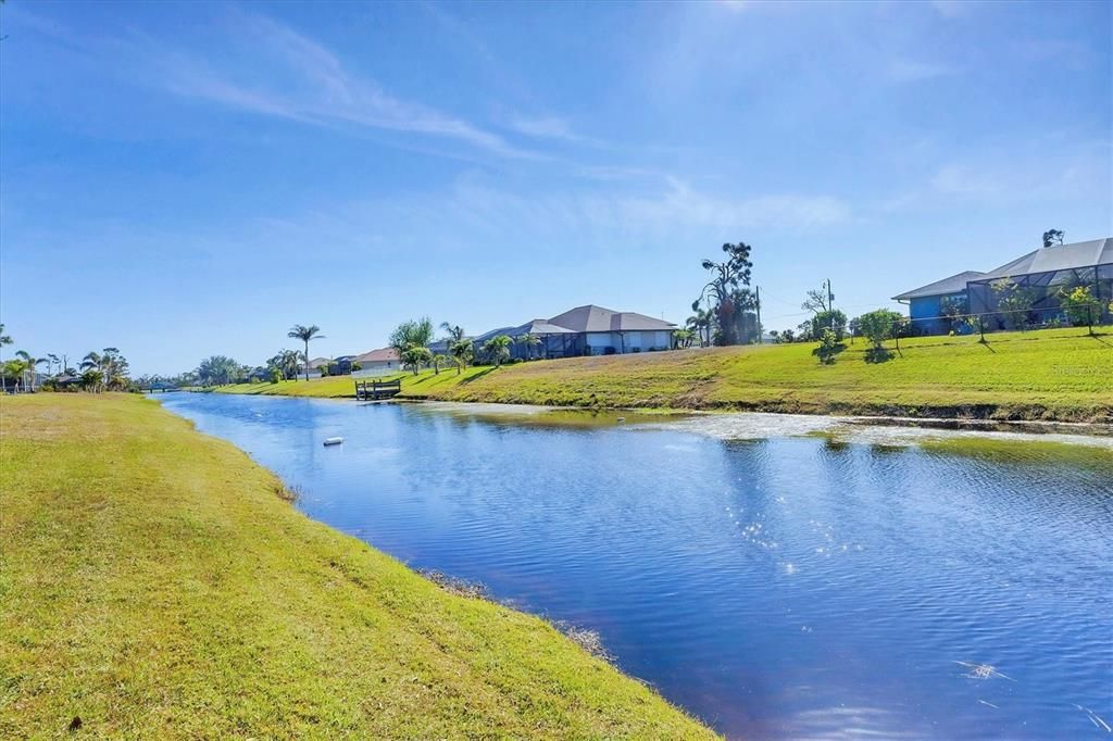 The canal is a tranquil backdrop to your private heated pool.