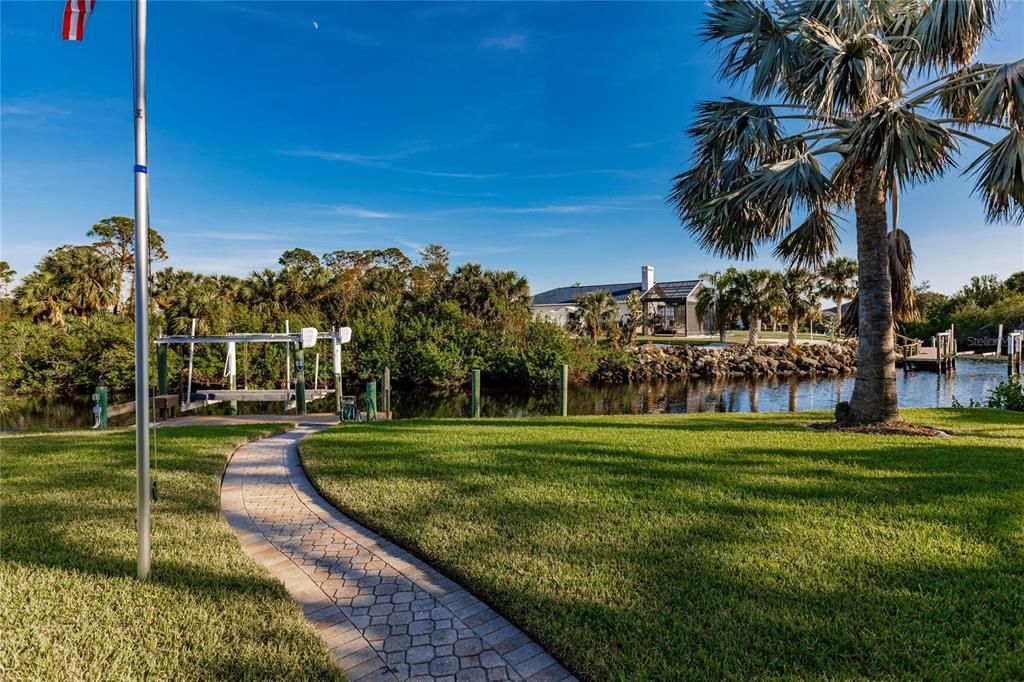 PAVED WALKWAY TO DOCK AND BOAT LIFT