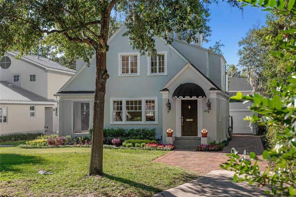 Welcoming and enhanced by the bricked driveway.