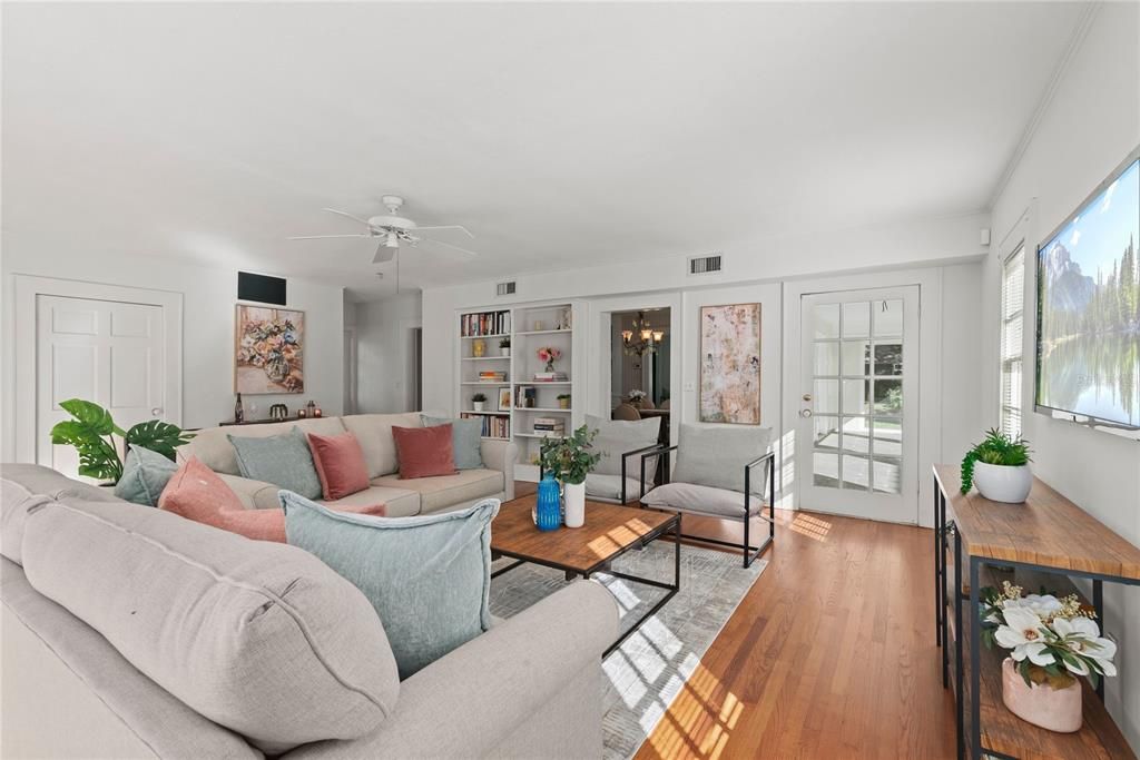 Large family room with built in bookcases.