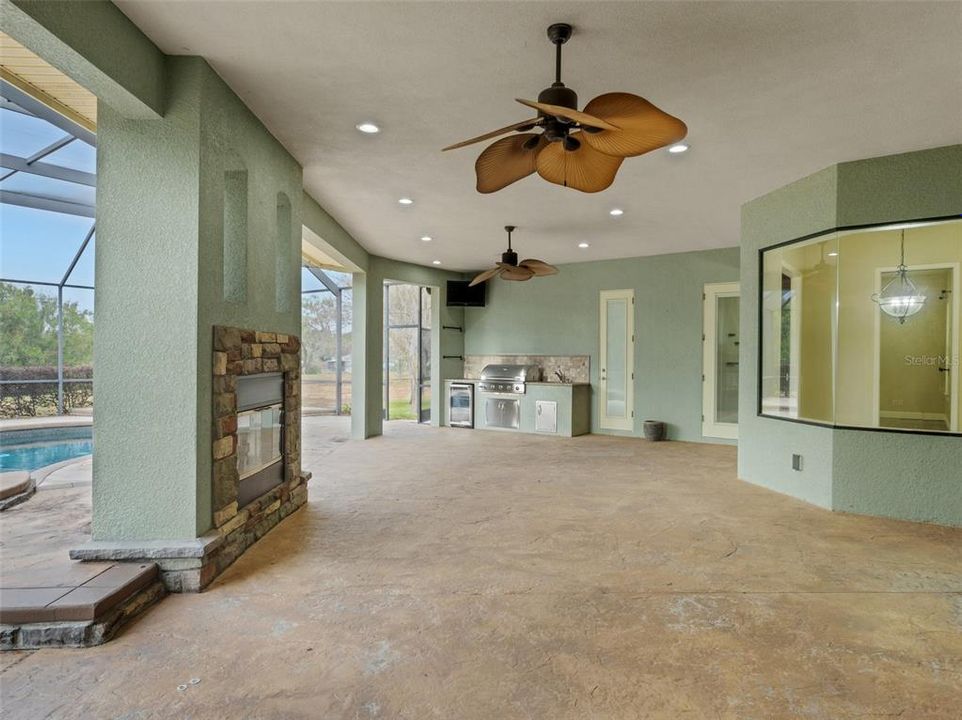 The outdoor area adjacent to the family room, and view into the kitchen