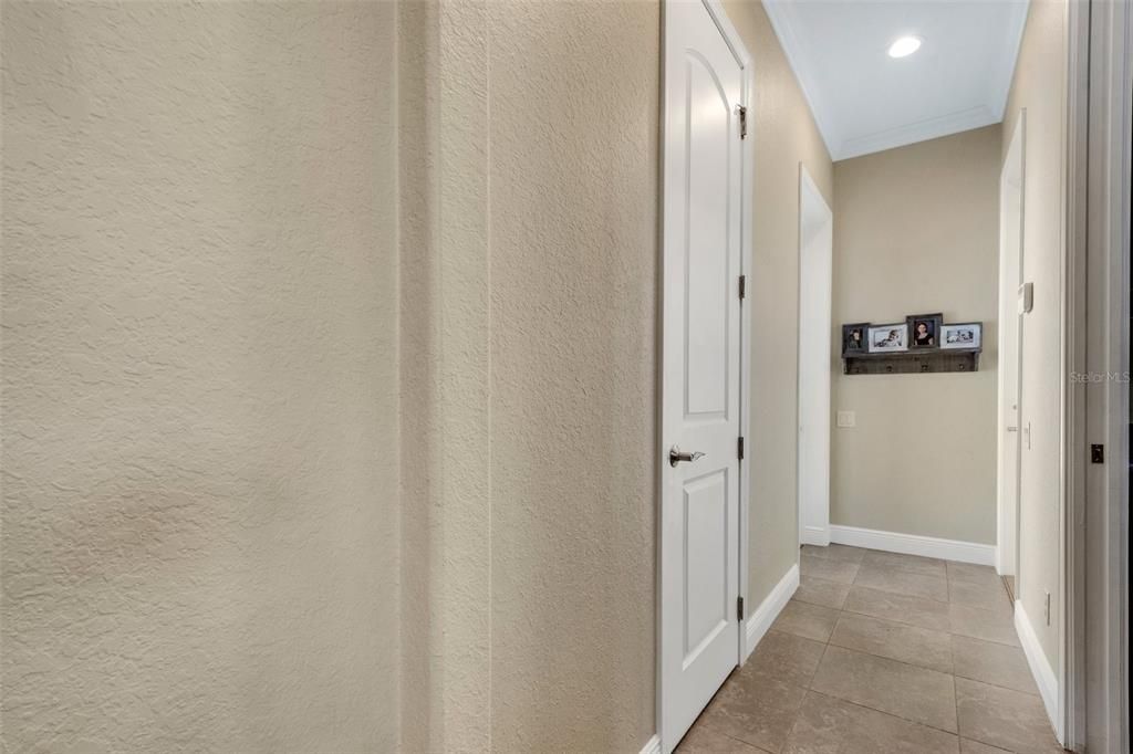 This hall leads to the Garage,Courtyard, half bath and Laundry room