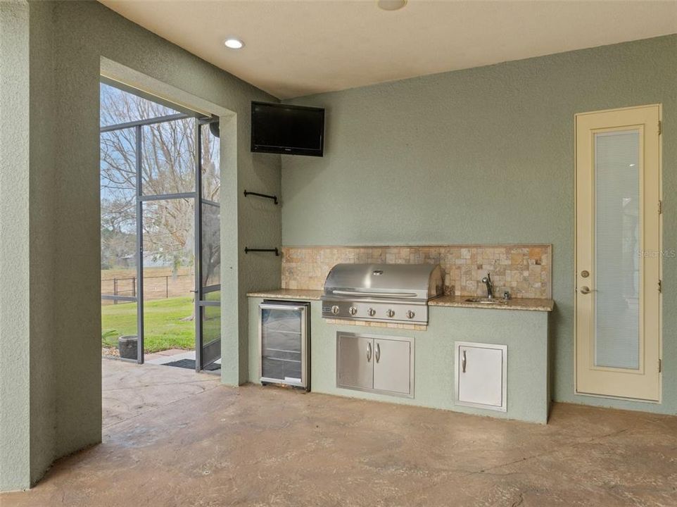 Gas grill, patio fridge and storage.