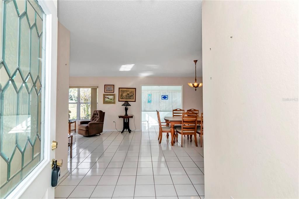 Walking into entry way from front door.  Feeling of space, light and bright.