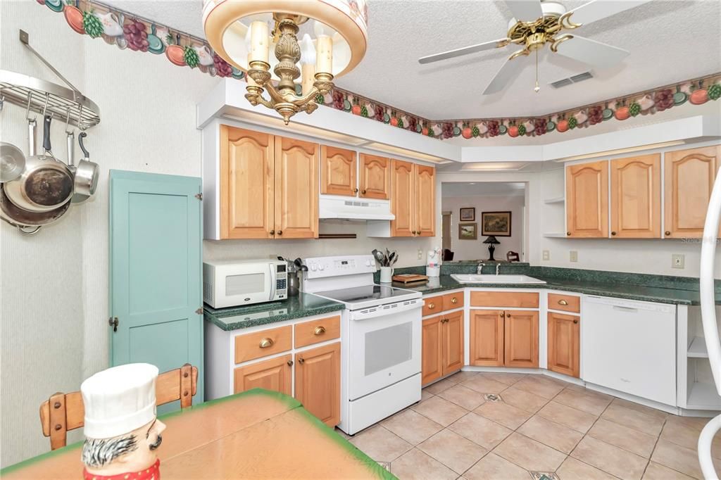 Large working kitchen with all white appliances