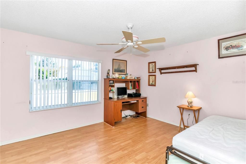 Guest bedroom in front of home, also being used as office