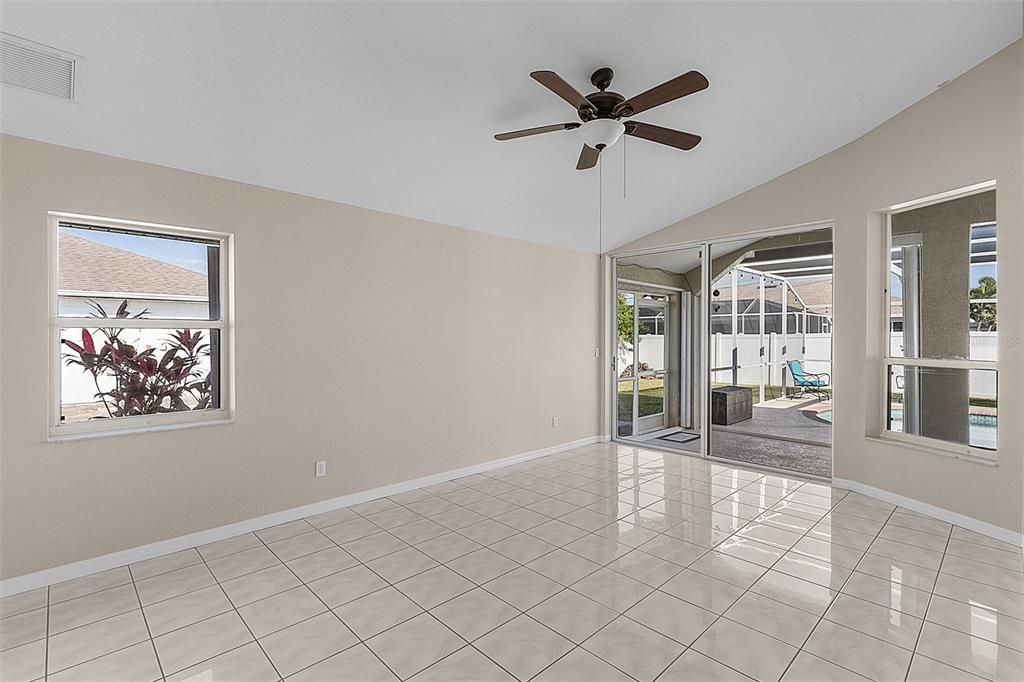 Primary Bedroom with Sliders to the Lanai and Pool Area.