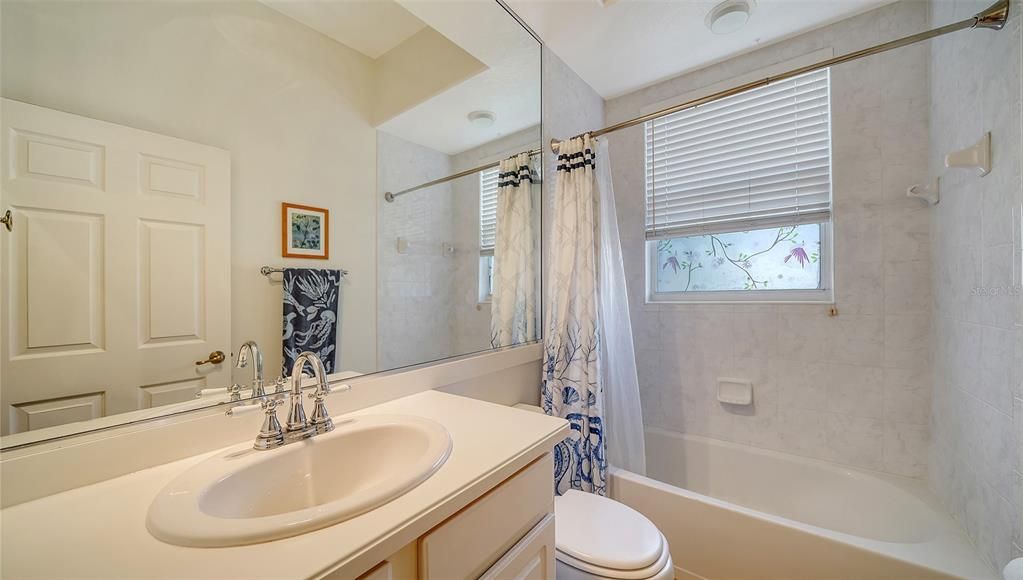 Guest bathroom with tub-shower combo