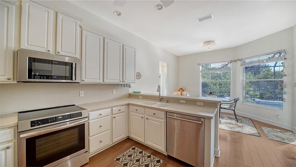 Kitchen with breakfast bar and eat-in area