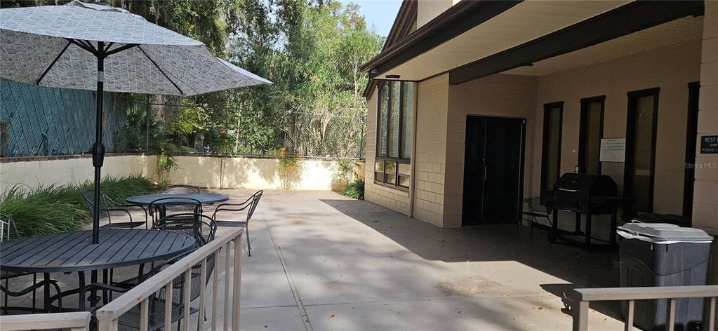 Back patio of the clubhouse building. BBQ and patio may be used by all residents.