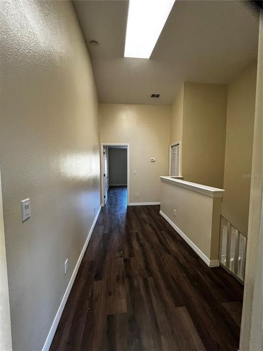 Upstairs hallway with skylight