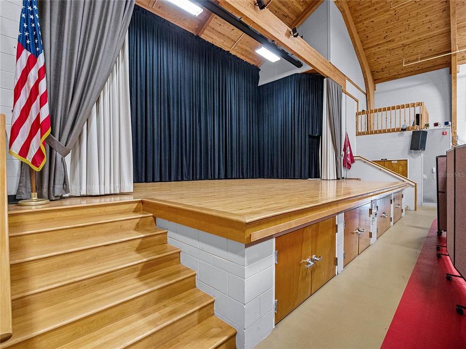 Stage in the Arena, including fully equipped kitchen for event hosting.