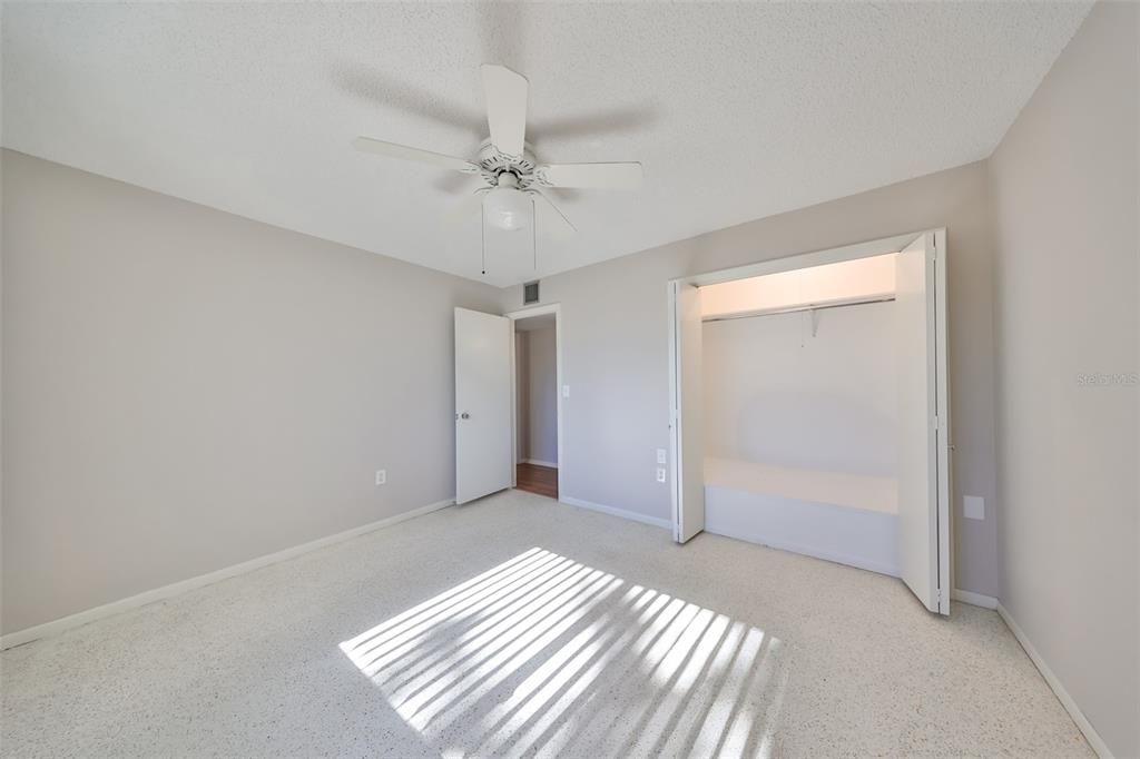 Bedroom 2, double door closet, ceiling fan