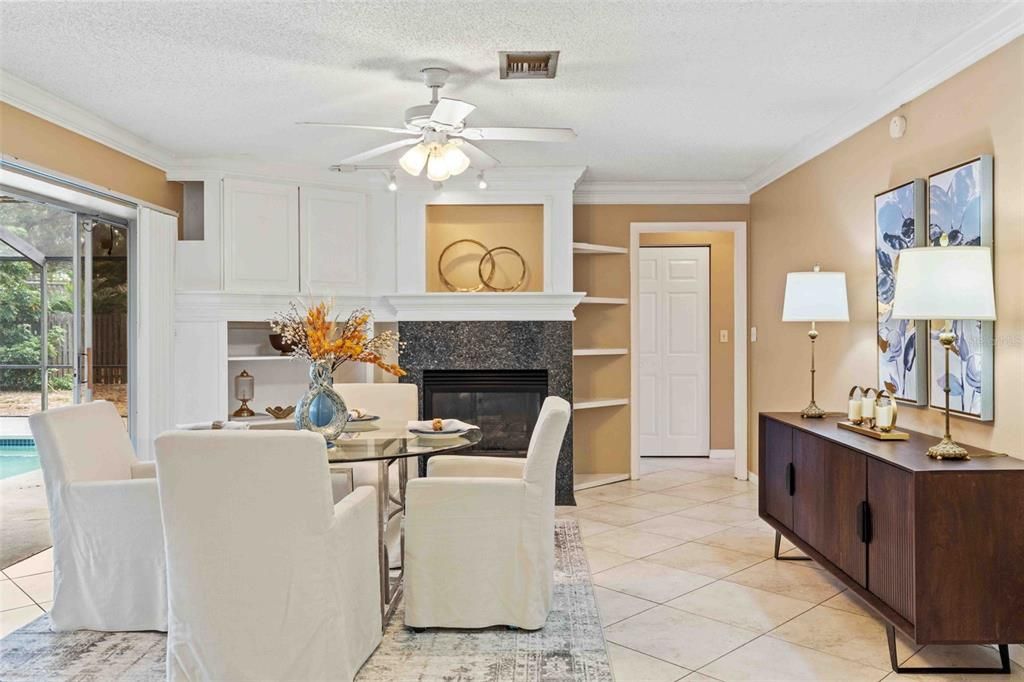 Family room with fireplace and access to pool