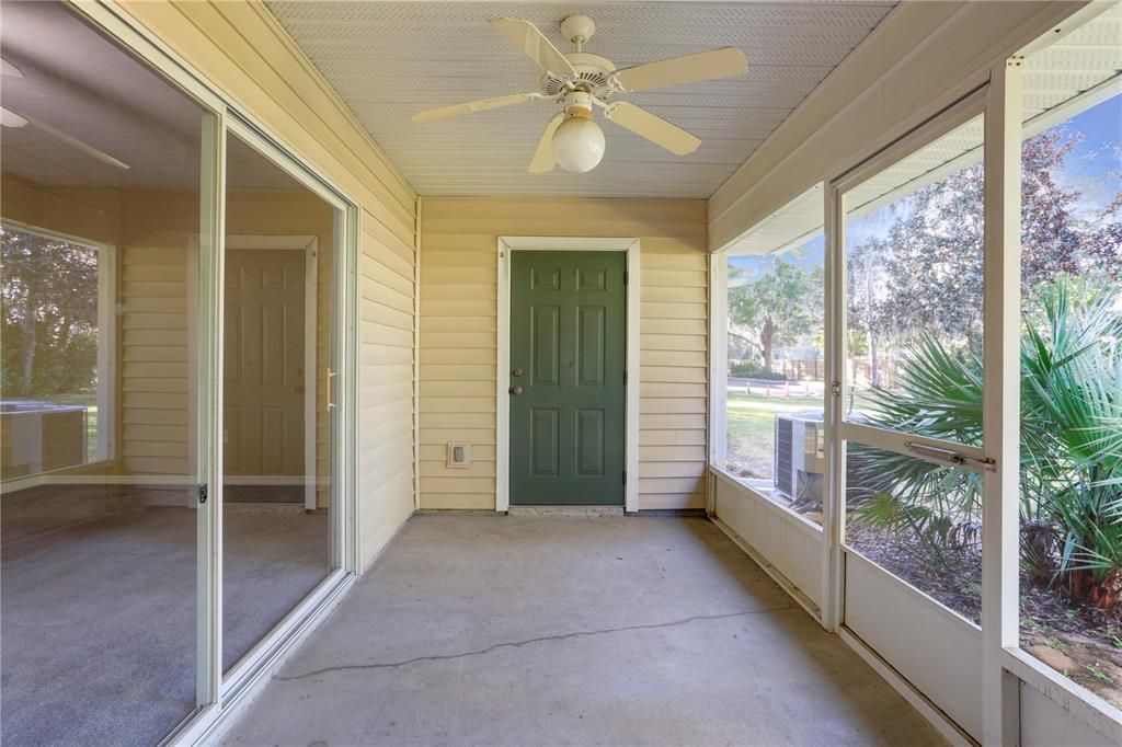 Large enclosed porch with exterior storage closet.