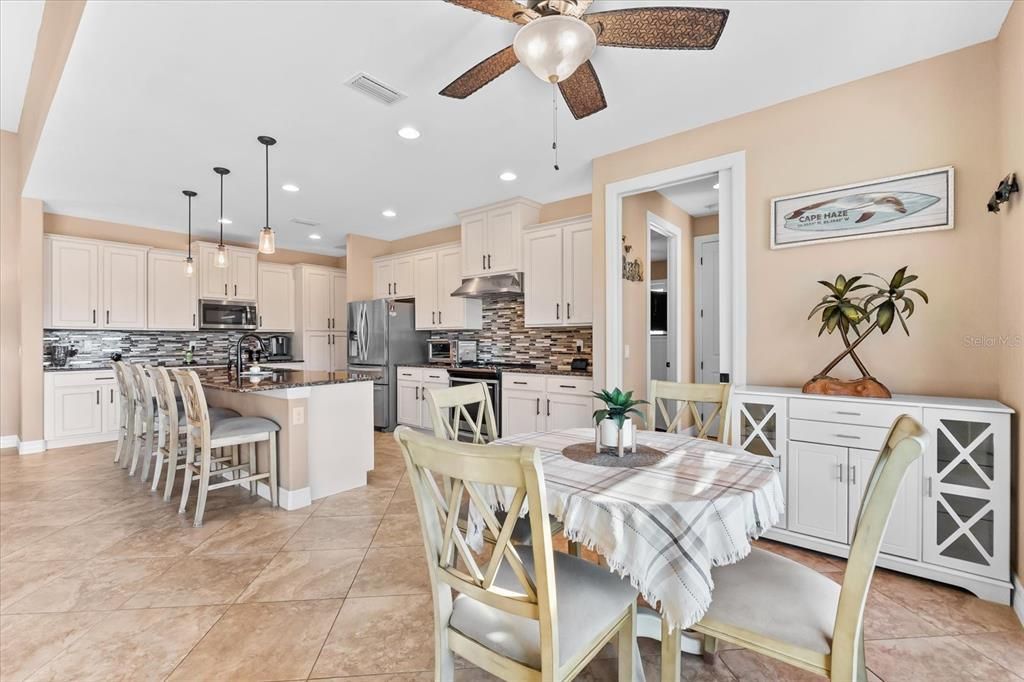 Dining Space with Pocket Doors for Added Privacy and Flow to Guest Rooms